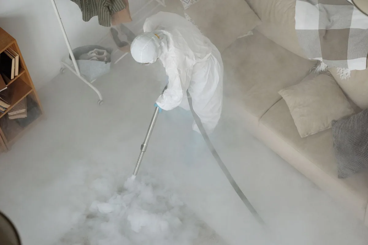 Biohazard cleanup technician in protective equipment, Live Oak, TX